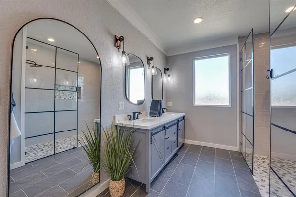 a bathroom with a sink a toilet and mirror