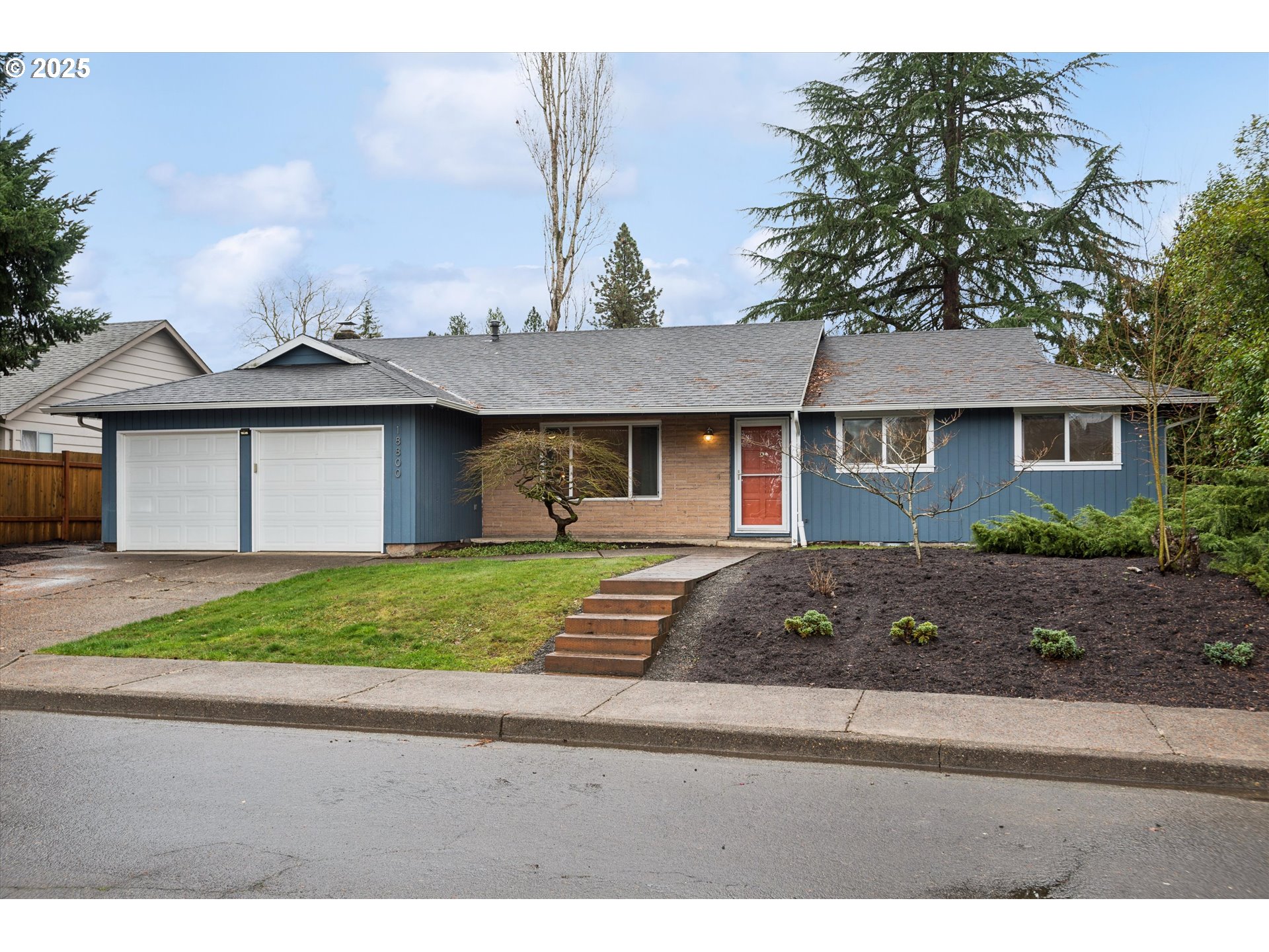 18800 Southwest Sandra Lane Beaverton, OR 97003 - Photo 1 of 41 a front view of a house with a yard and garage