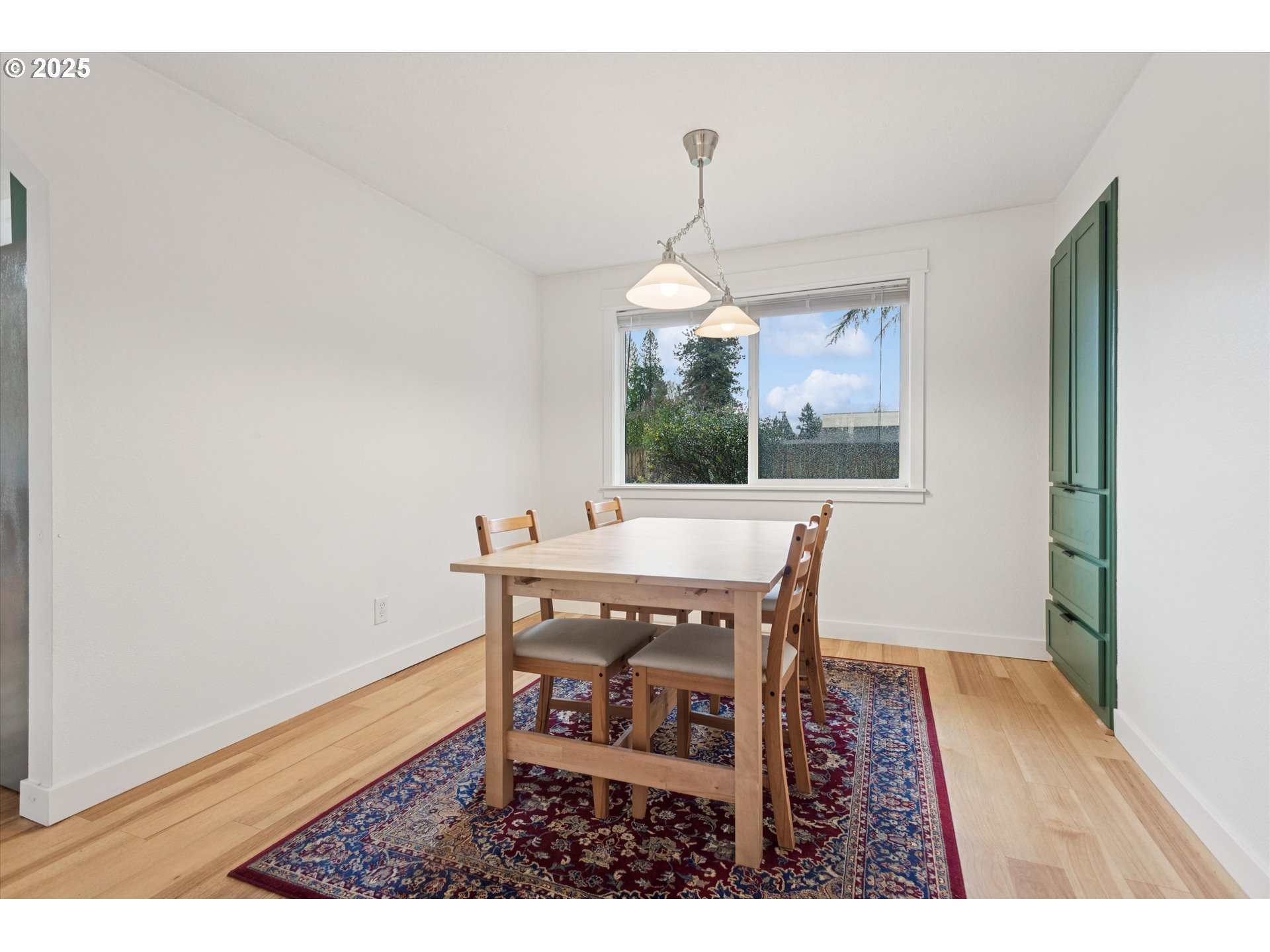 18800 Southwest Sandra Lane Beaverton, OR 97003 - Photo 11 of 41 a view of a dining room with furniture window and wooden floor