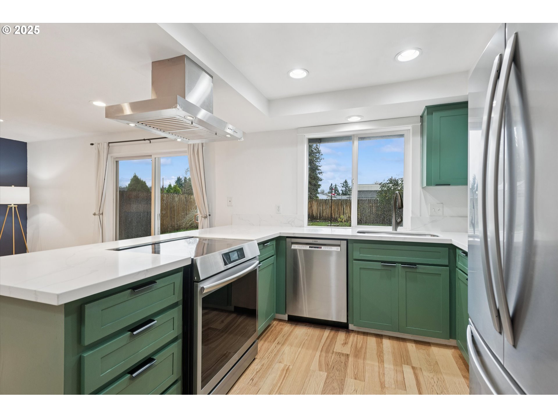 18800 Southwest Sandra Lane Beaverton, OR 97003 - Photo 13 of 41 a kitchen with a sink and a large window