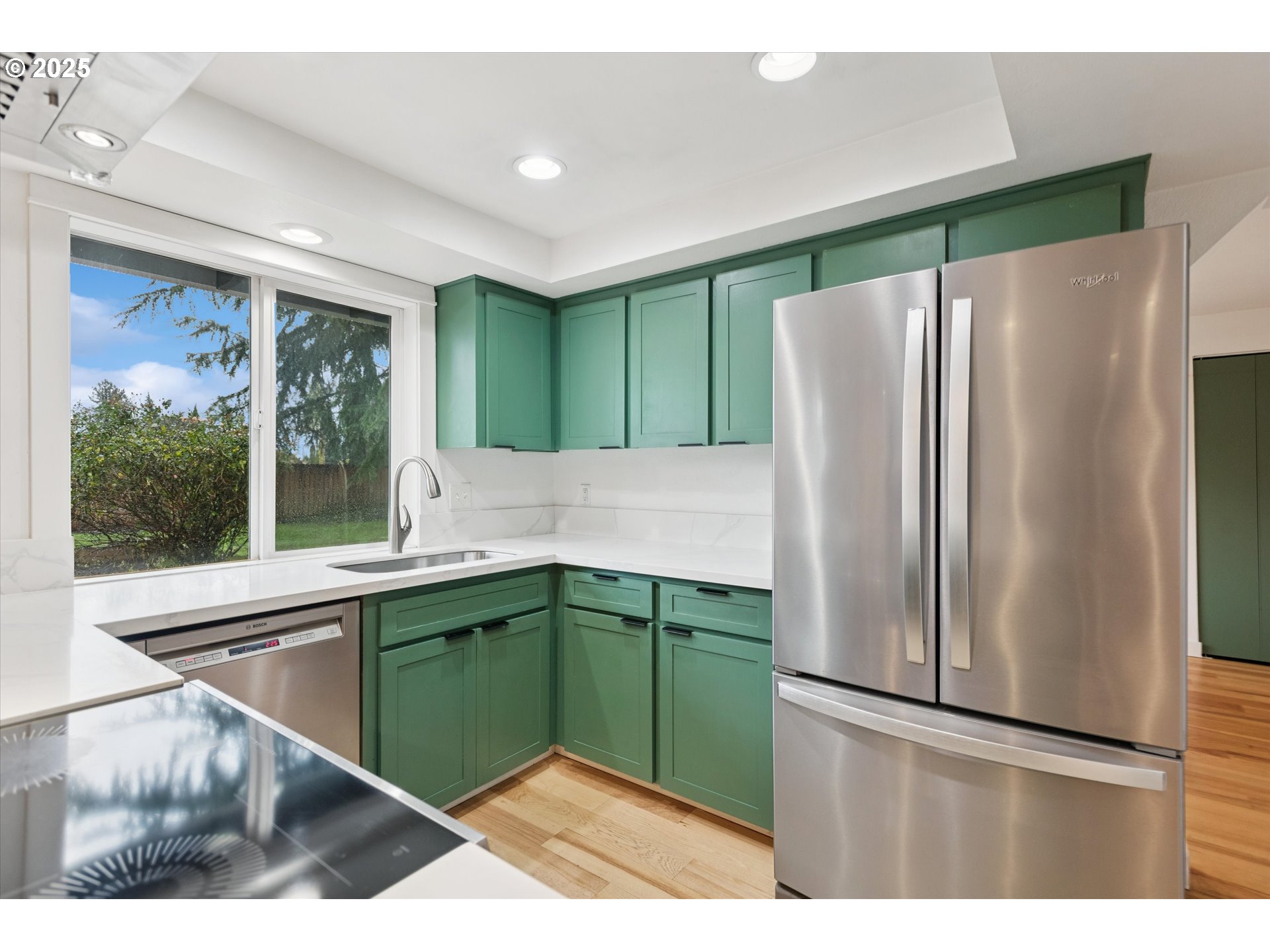 18800 Southwest Sandra Lane Beaverton, OR 97003 - Photo 15 of 41 a kitchen with stainless steel appliances granite countertop a refrigerator and a sink
