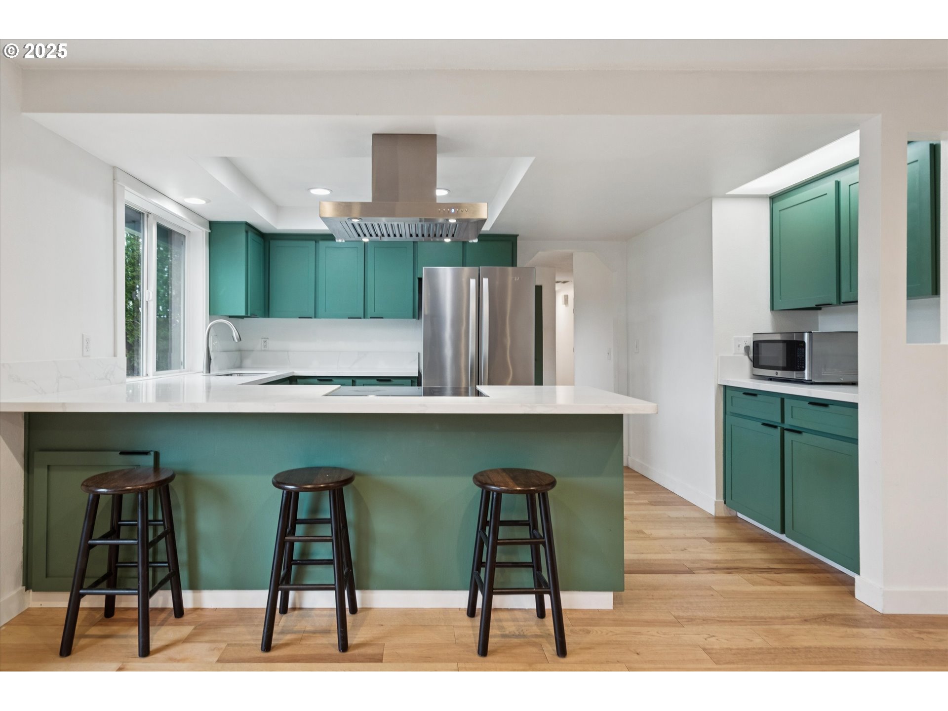 18800 Southwest Sandra Lane Beaverton, OR 97003 - Photo 16 of 41 a kitchen with a table chairs and wooden floor