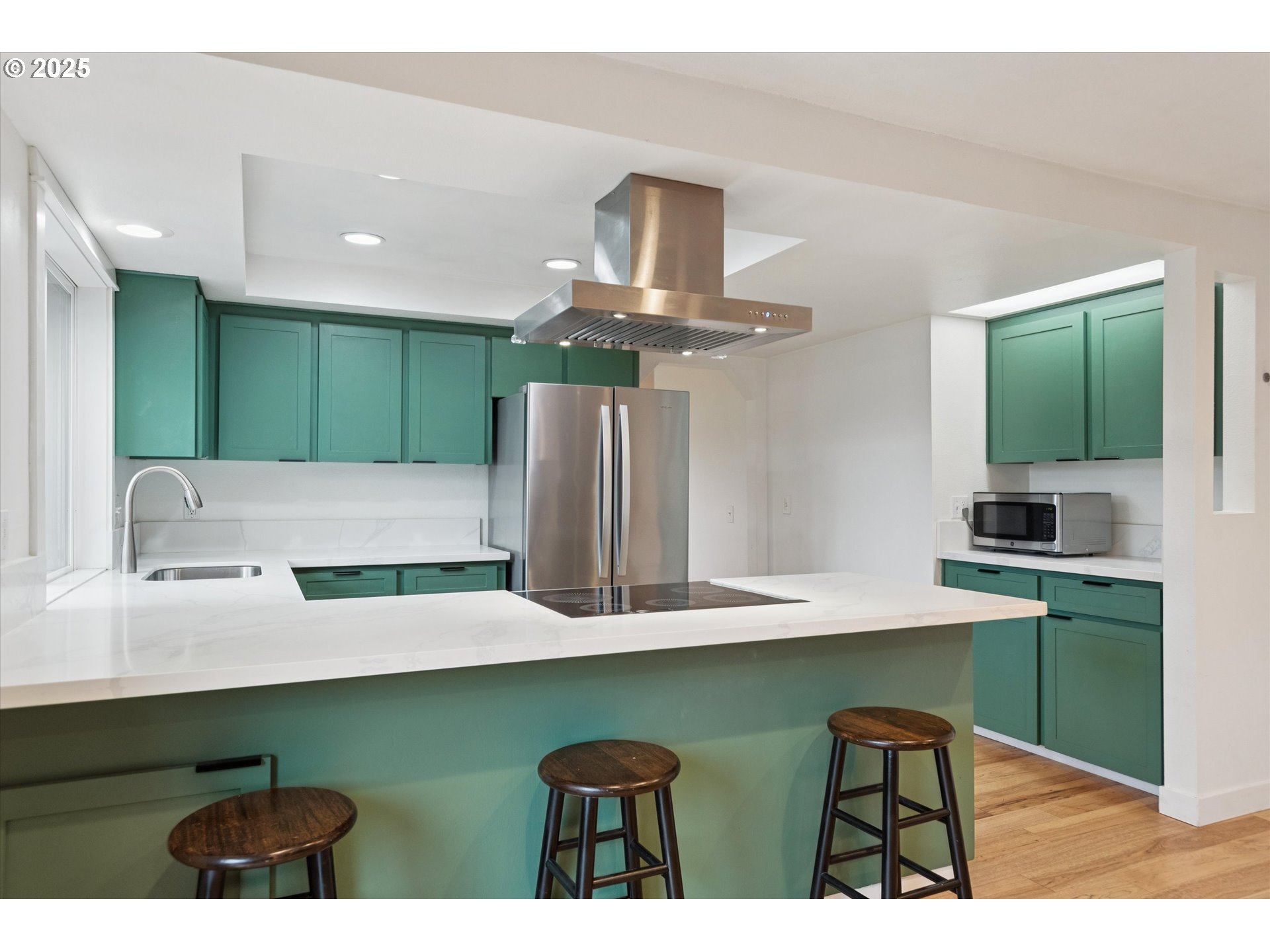 18800 Southwest Sandra Lane Beaverton, OR 97003 - Photo 17 of 41 a kitchen with kitchen island a sink stainless steel appliances and cabinets