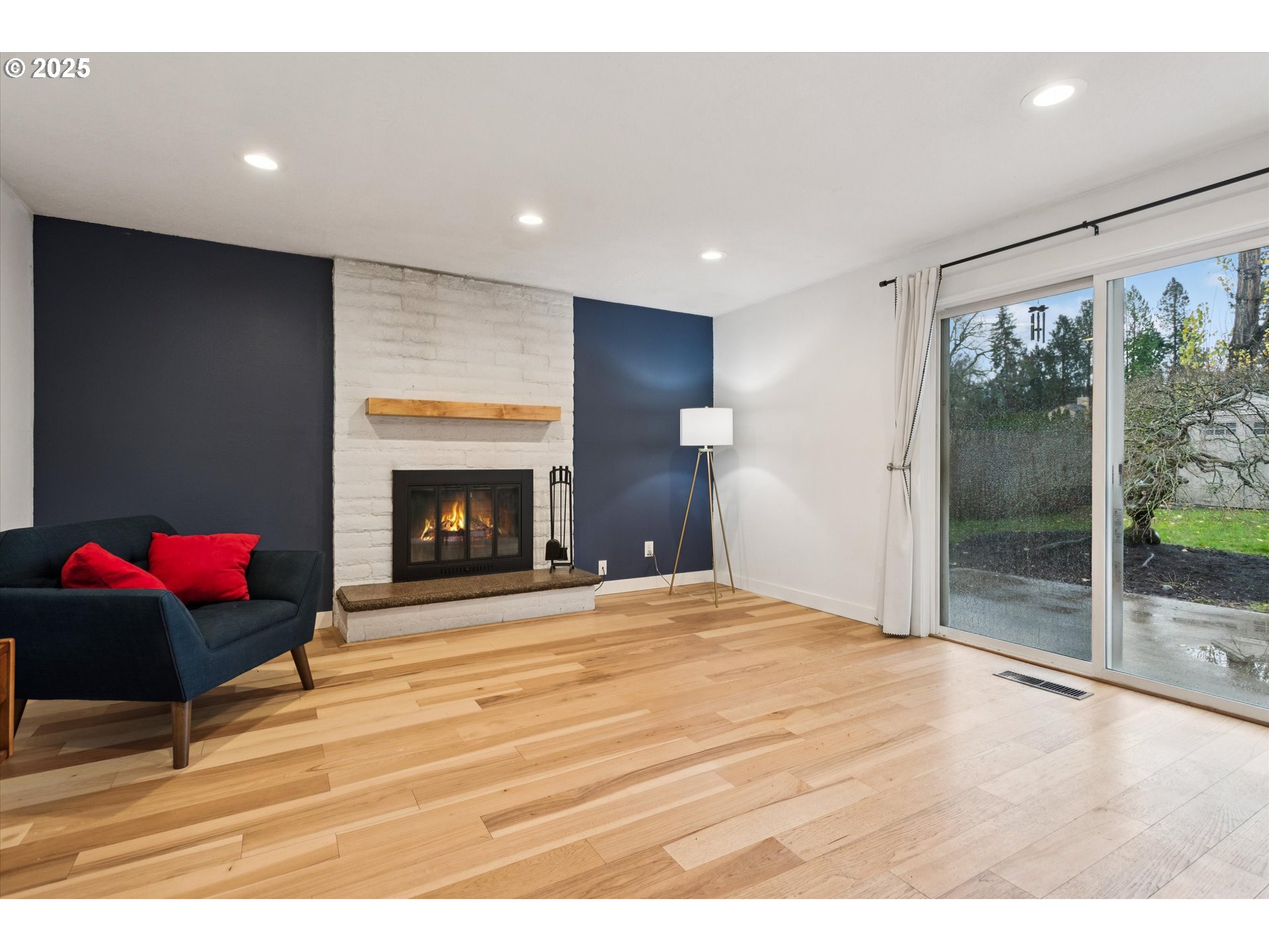 18800 Southwest Sandra Lane Beaverton, OR 97003 - Photo 18 of 41 a room with a bed and a fireplace