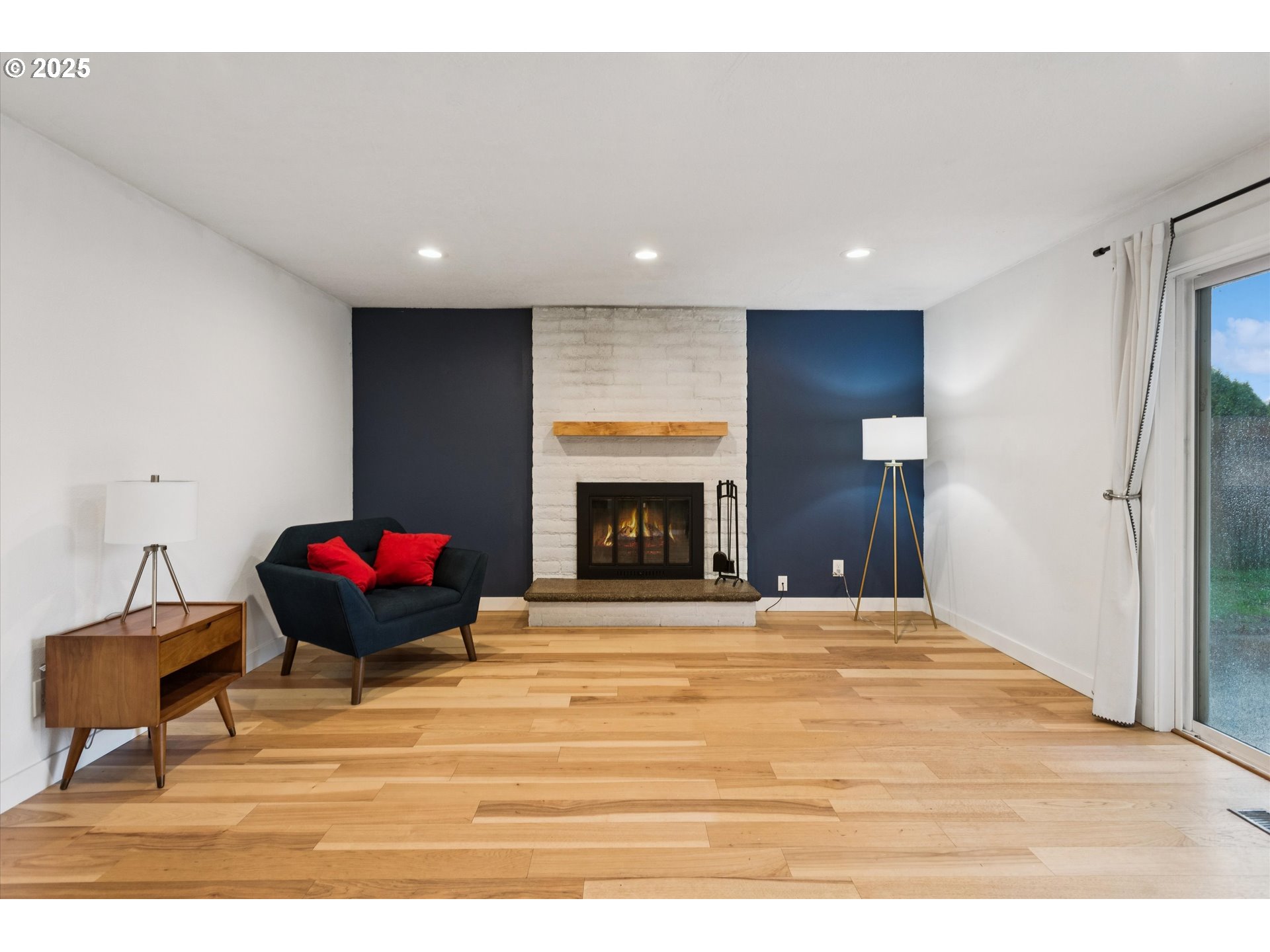 18800 Southwest Sandra Lane Beaverton, OR 97003 - Photo 19 of 41 a room with a bed and a fireplace