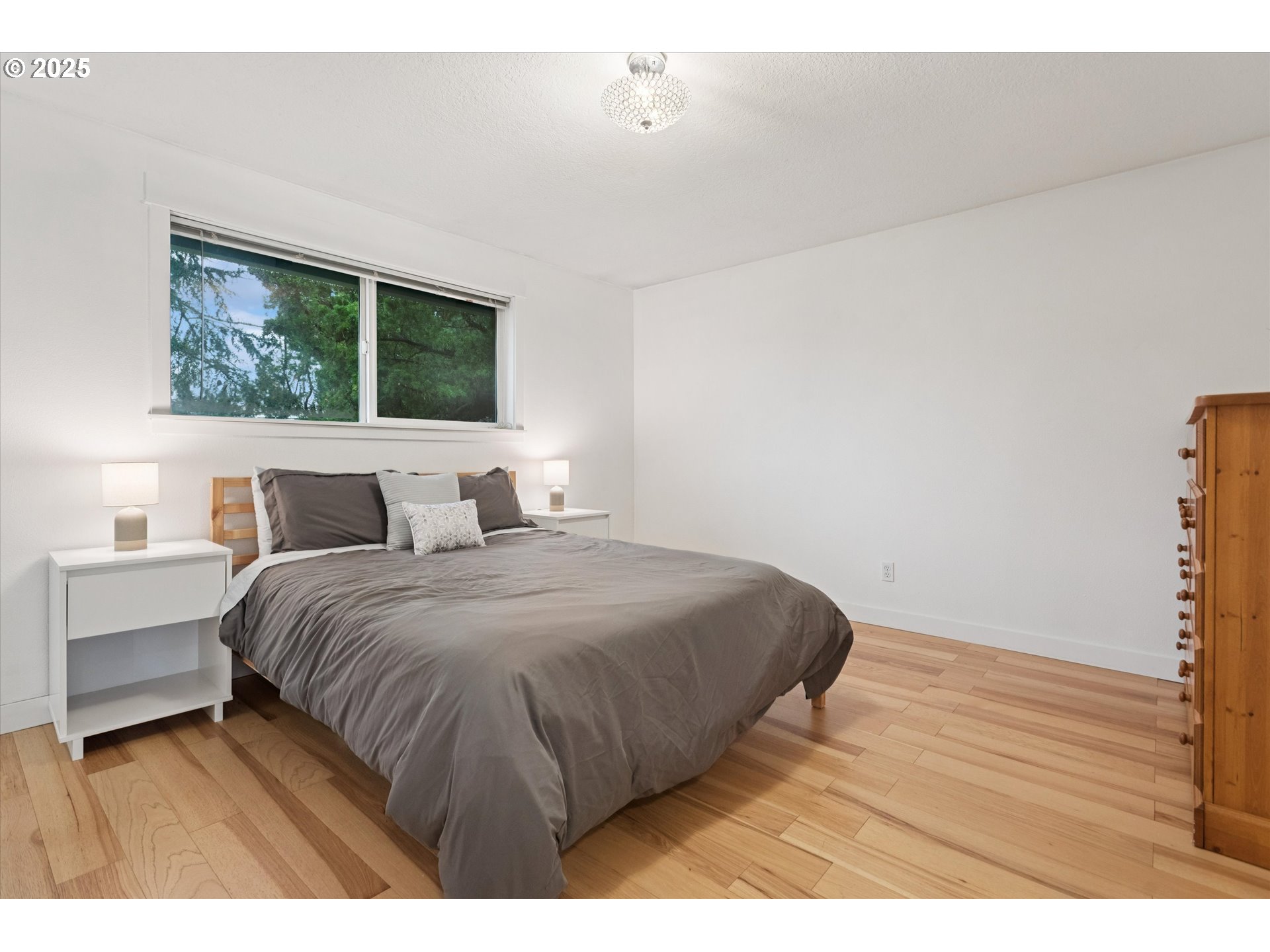 18800 Southwest Sandra Lane Beaverton, OR 97003 - Photo 22 of 41 a bedroom with a bed and a window