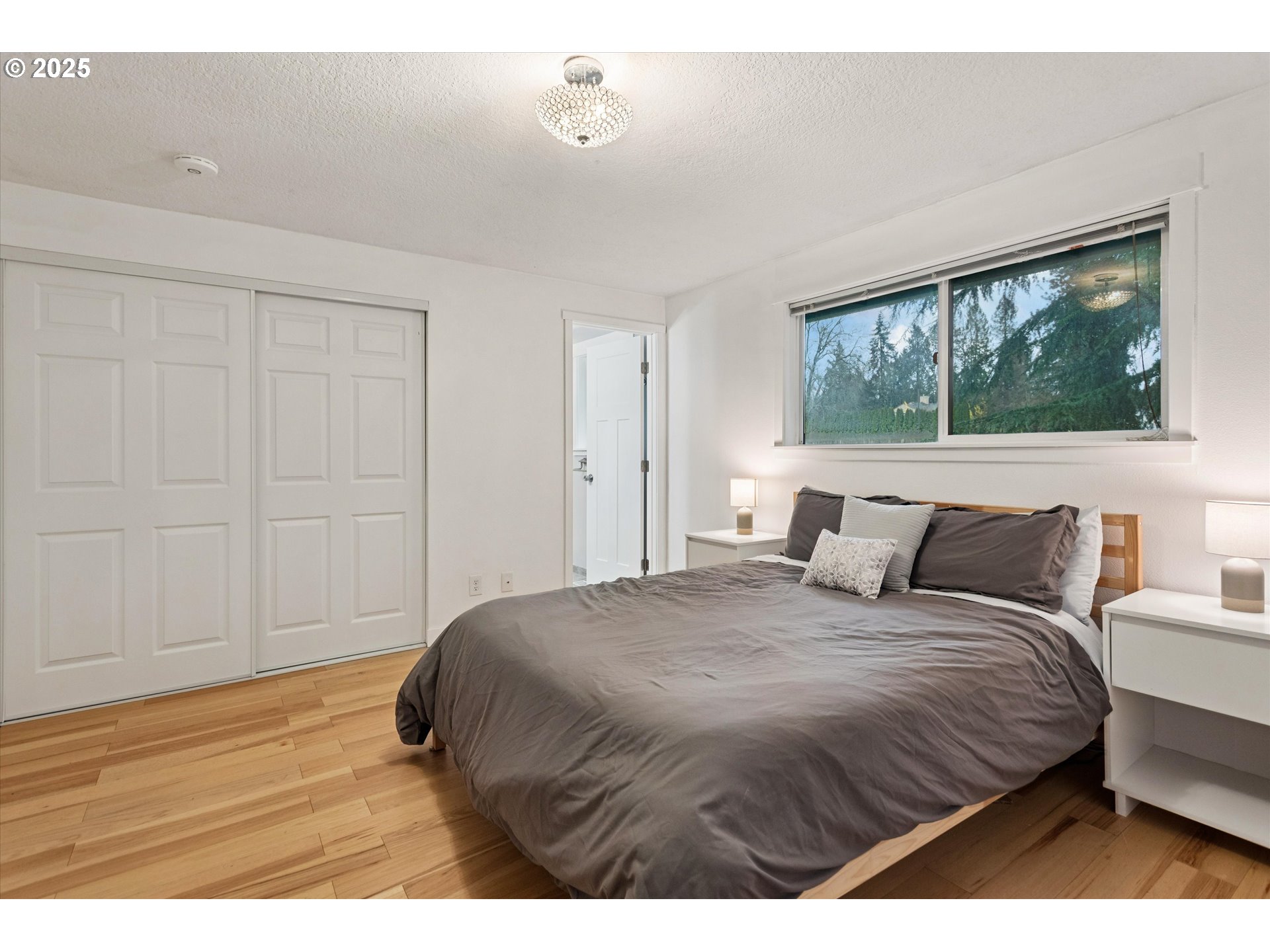 18800 Southwest Sandra Lane Beaverton, OR 97003 - Photo 23 of 41 a bedroom with a bed and a large window