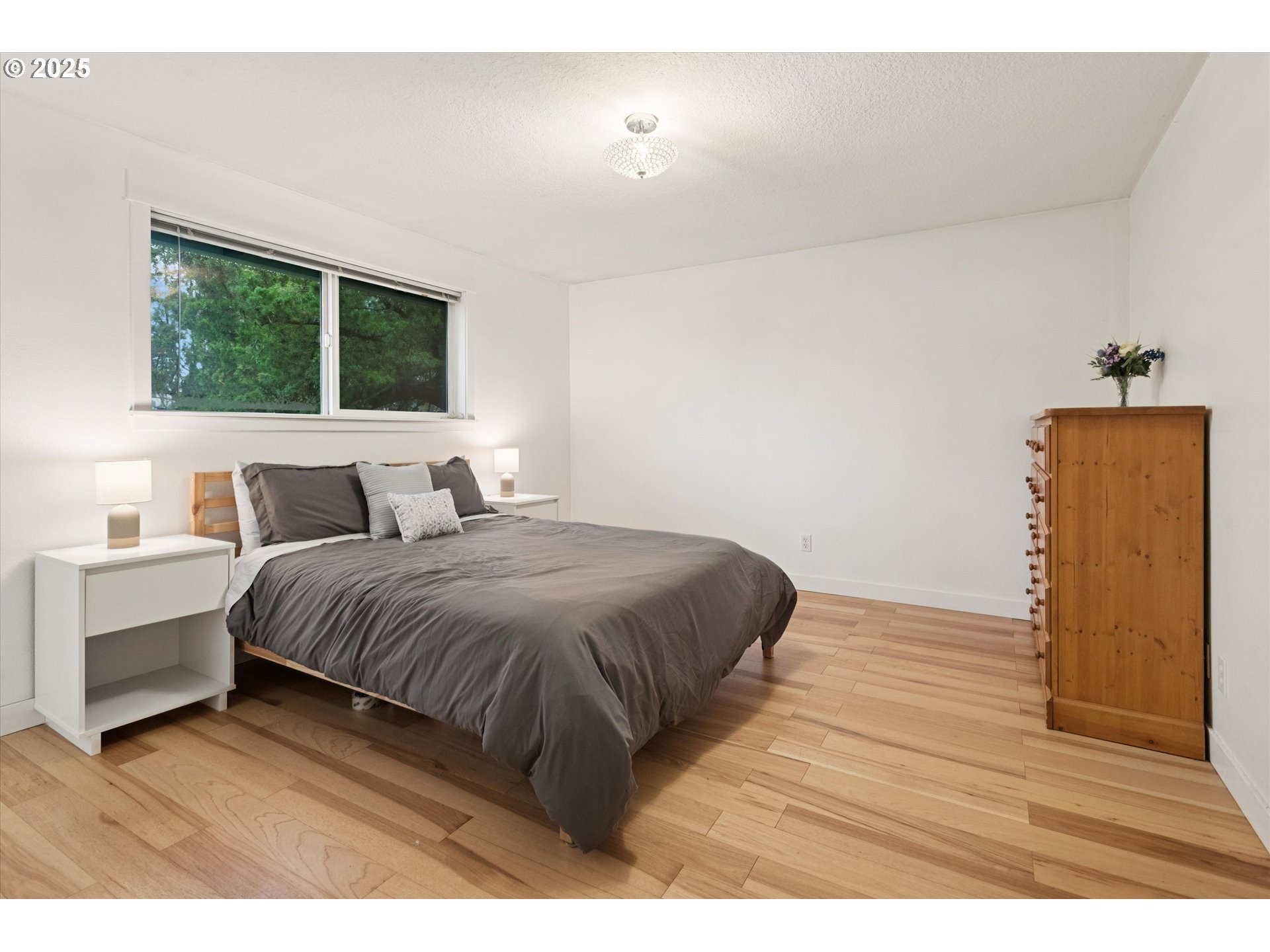 18800 Southwest Sandra Lane Beaverton, OR 97003 - Photo 25 of 41 a bedroom with a bed and a window