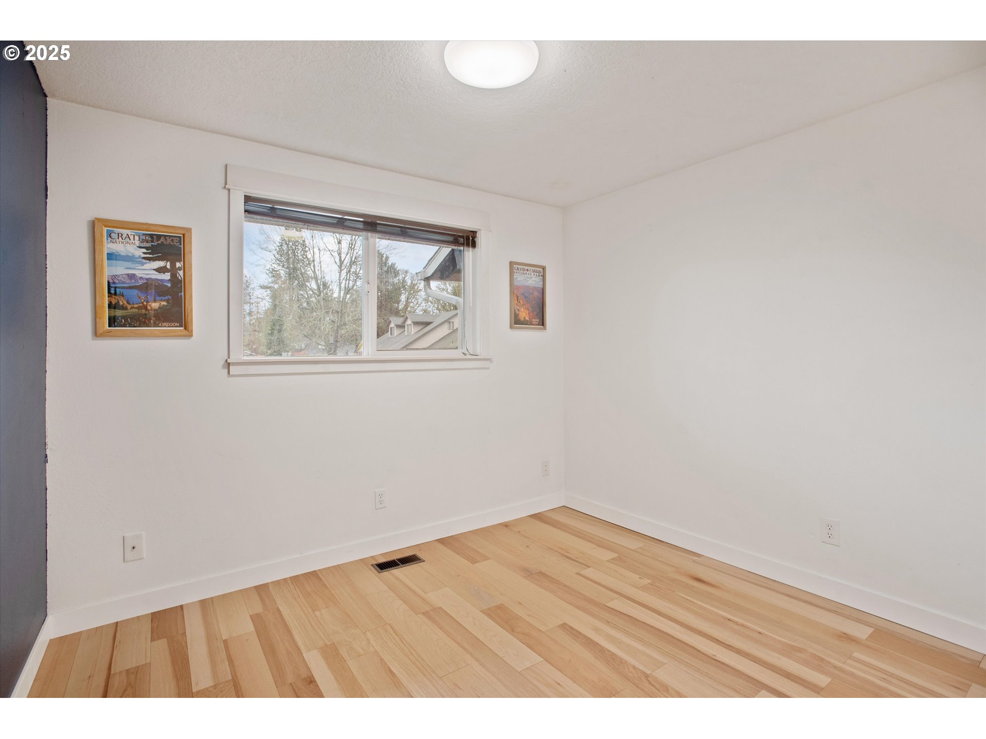 18800 Southwest Sandra Lane Beaverton, OR 97003 - Photo 30 of 41 an empty room with wooden floor and windows
