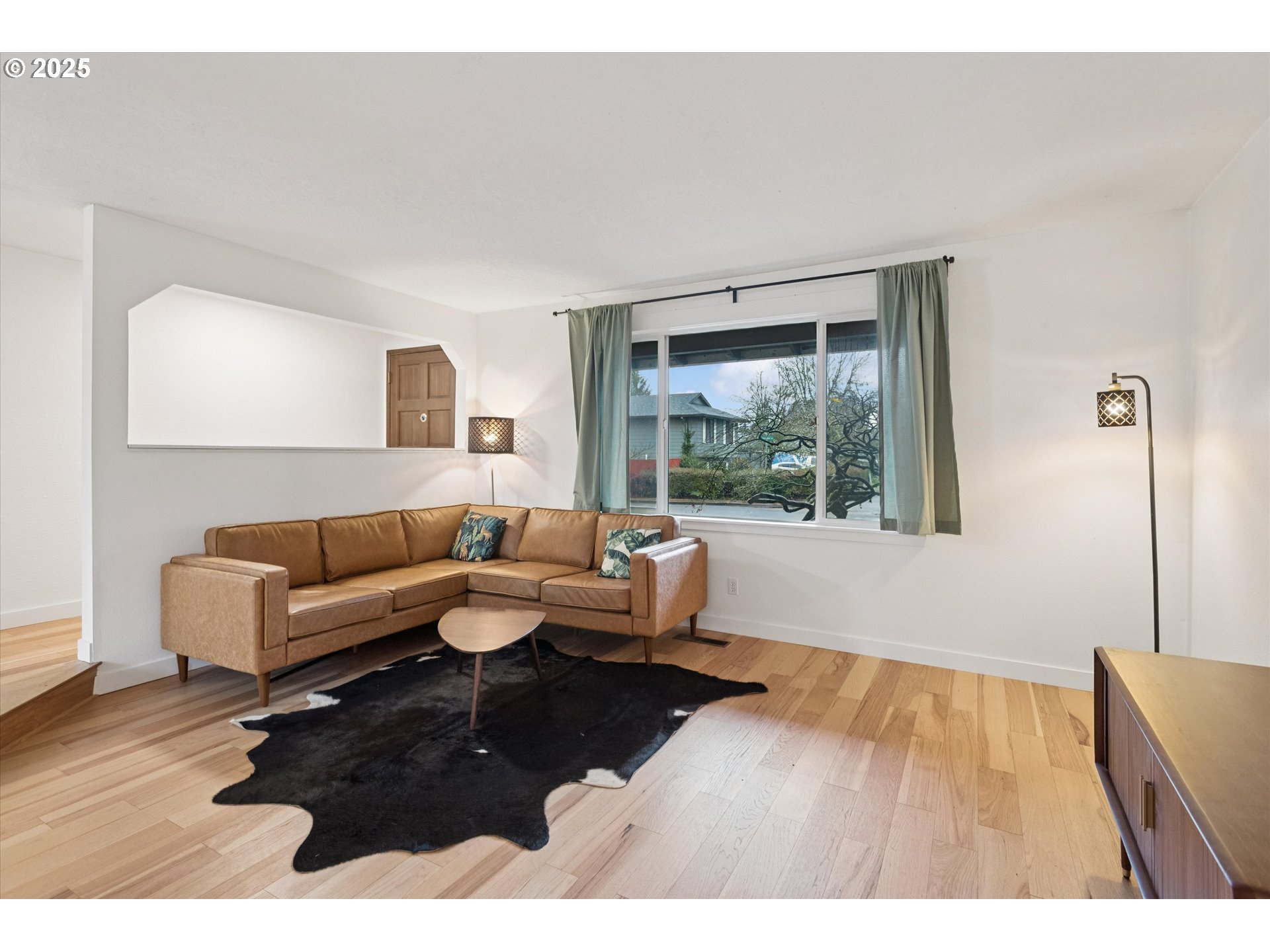 18800 Southwest Sandra Lane Beaverton, OR 97003 - Photo 6 of 41 a living room with furniture and a large window