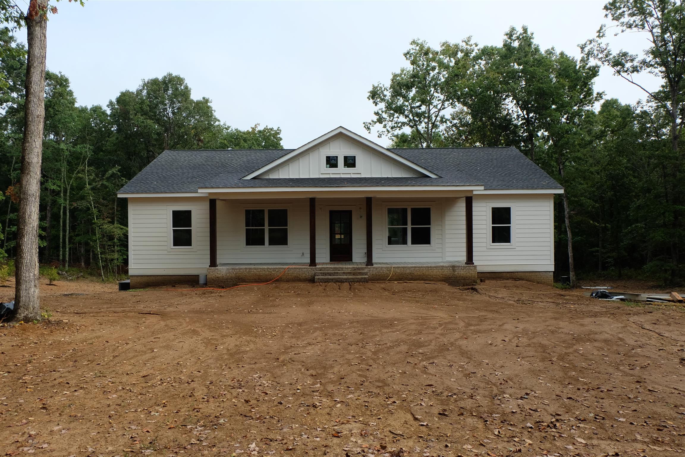753 Billy Wynn Road Dickson, TN 37055 - Photo 1 of 22 a front view of a house with a garden