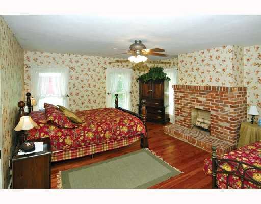171 Pogue Road West Alexander, PA 15376 - Photo 5 of 8 Other. The individually named bedrooms will be comforting to your guests. The Rose Room pictured here offers great views of the property from its many windows and creates a cozy feel with the brick fireplace, hardwood floors and charming decor.