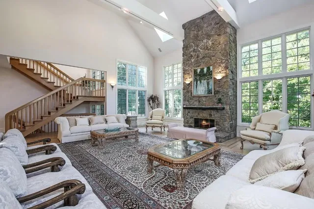 a living room with furniture windows and a fireplace