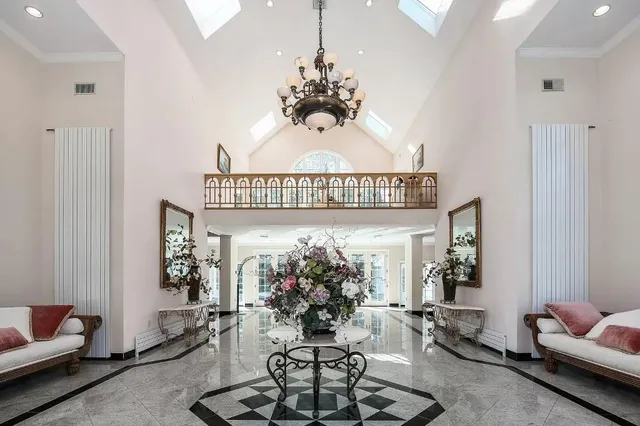 a view of a livingroom with furniture and a chandelier