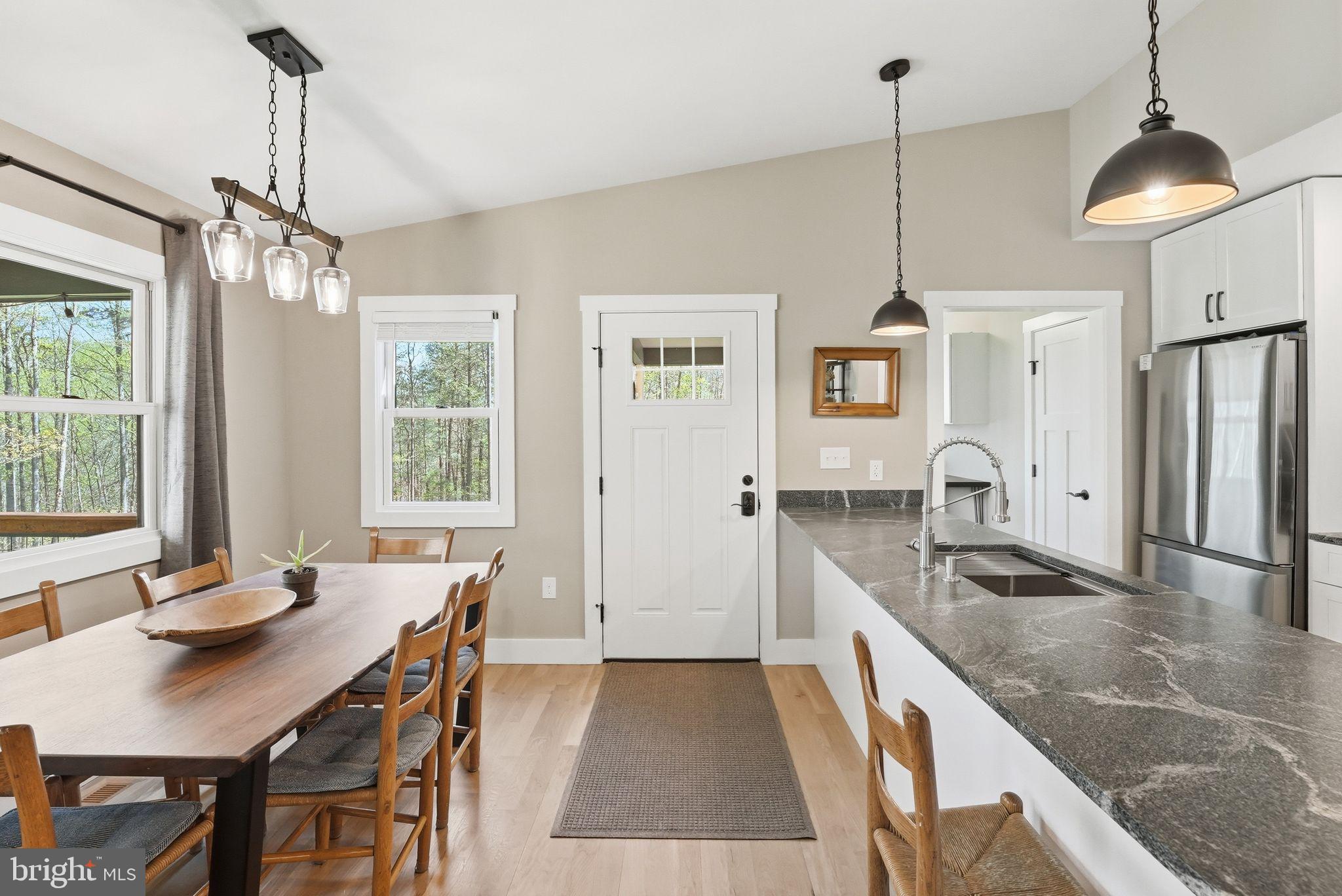 677 Weaver Hollow Road Banco, VA 22711 - Photo 9 of 34 Great room w/ kitchen, dining area and living room