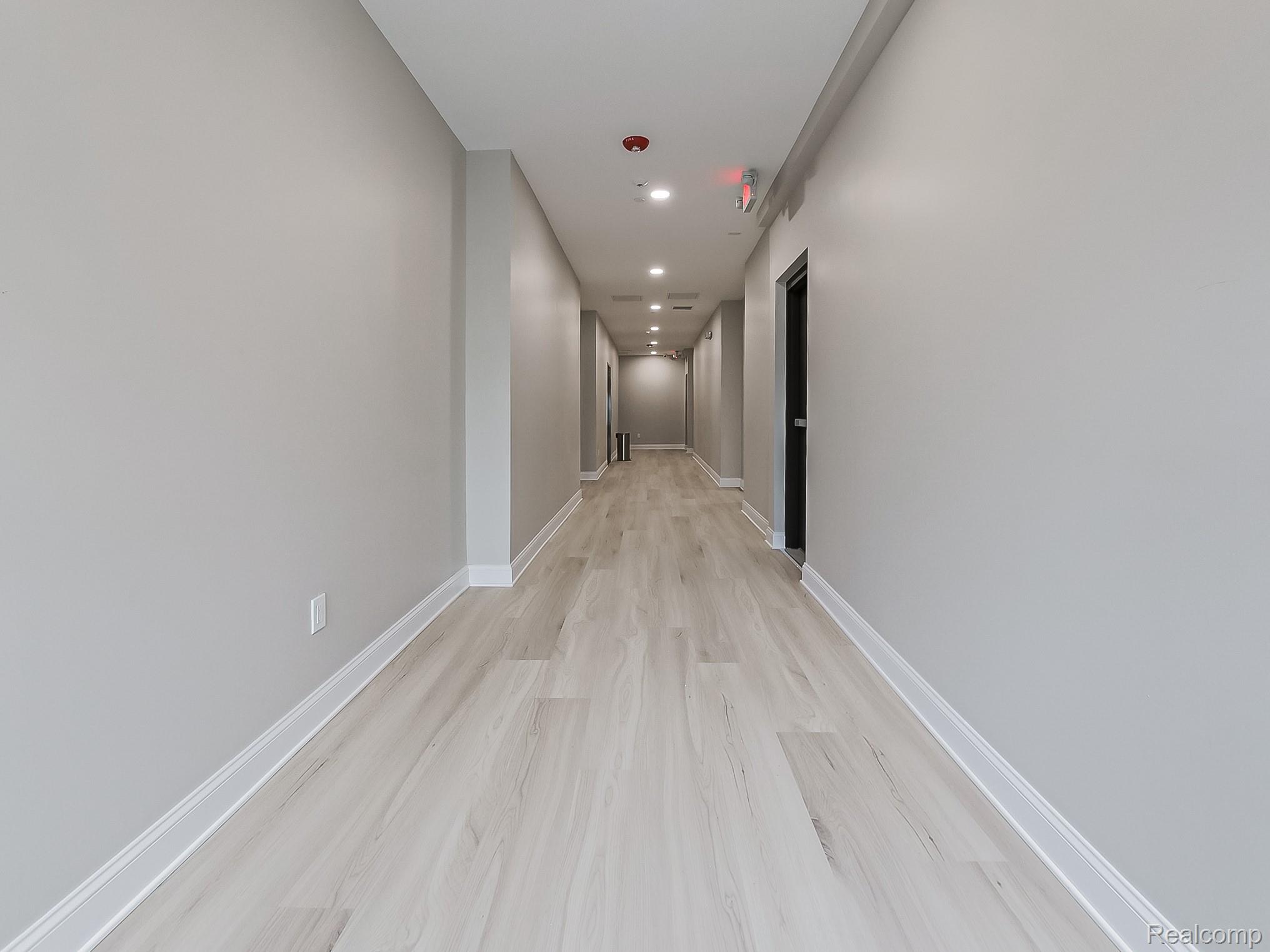 31480 Warren Road, Unit 101 Westland, MI 48185 - Photo 19 of 26 Hallway with light wood-style floors and recessed lighting