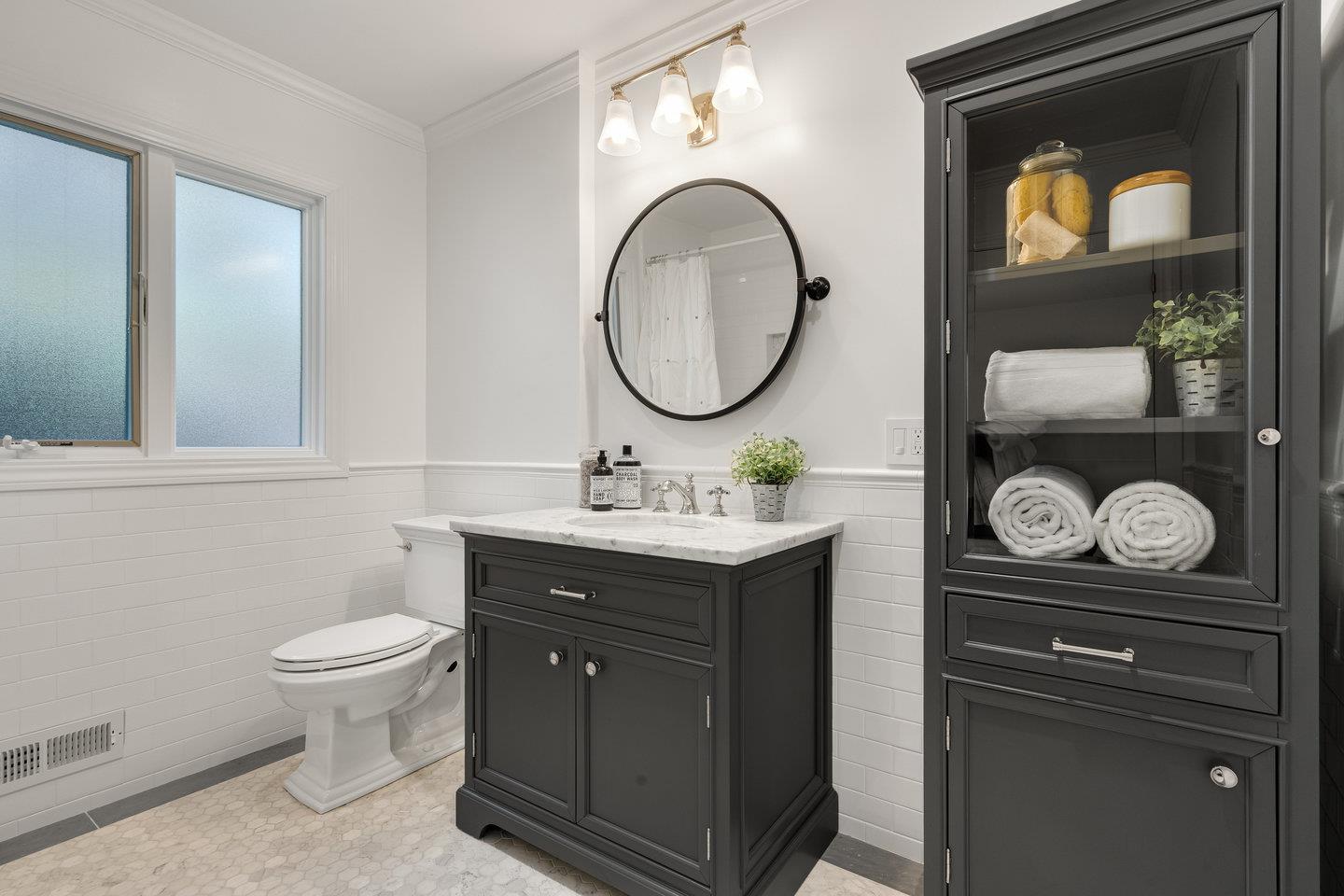 1270 Roble Road Millbrae, CA 94030 - Photo 24 of 35 a bathroom with a toilet a sink and a mirror