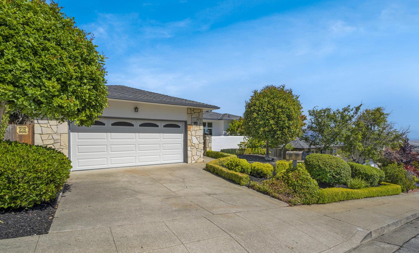 1270 Roble Road Millbrae, CA 94030 - Photo 4 of 35 a house with a yard and parking space
