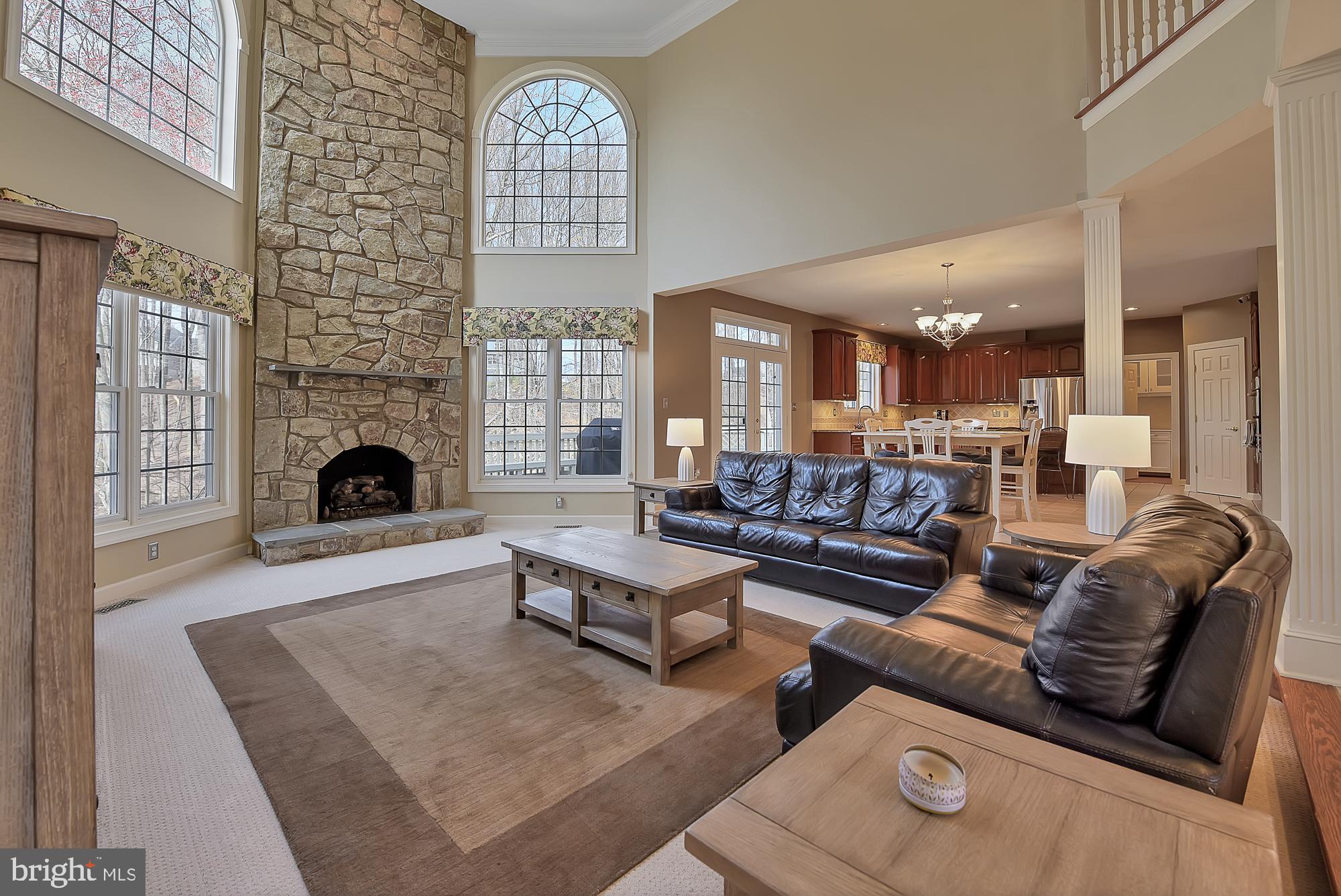 22 Hackett Court Poolesville, MD 20837 - Photo 13 of 54 Two story great room with stone fireplace