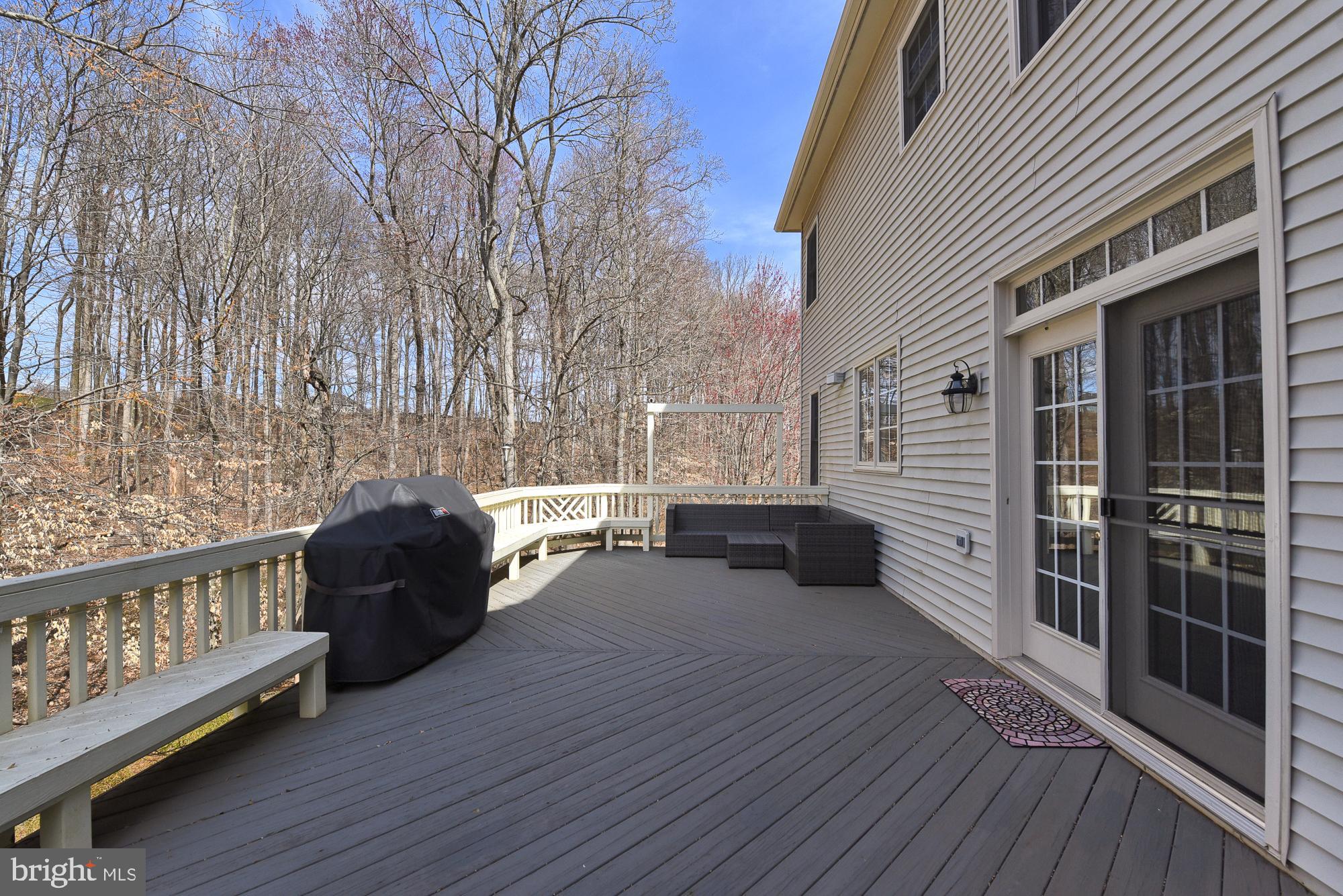22 Hackett Court Poolesville, MD 20837 - Photo 8 of 54 Expansive deck with wooded views