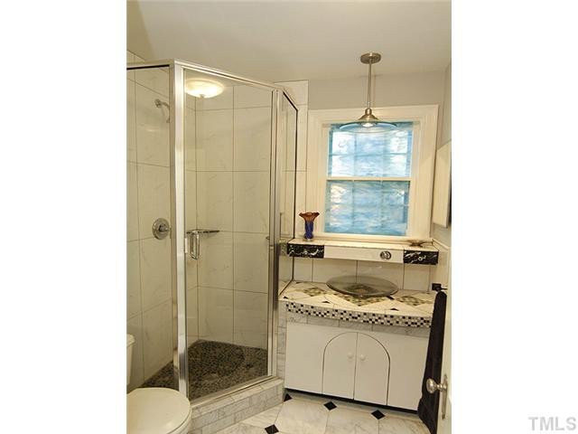 309 Cedar Street Raleigh, NC 27604 - Photo 14 of 25 Hall custom bathroom features custom tile work. Bathroom