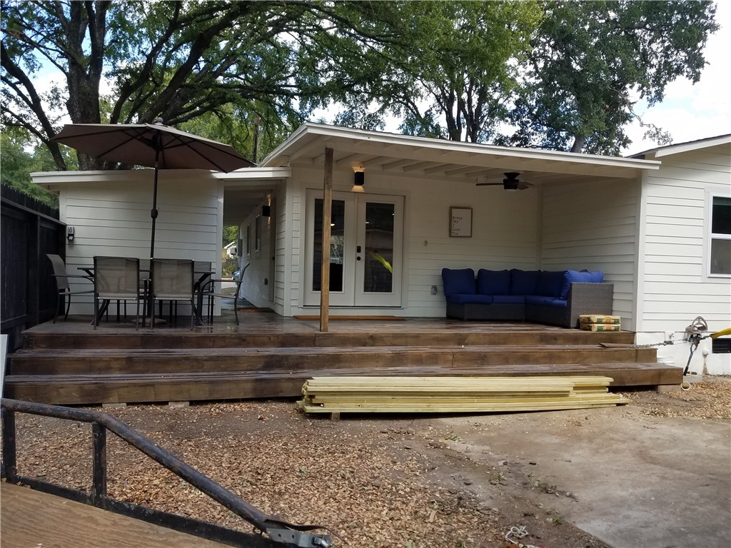 5405 Hudson Street Austin, TX 78721 - Photo 3 of 37 An inviting wood deck creates ample space for outdoor living and relaxation.