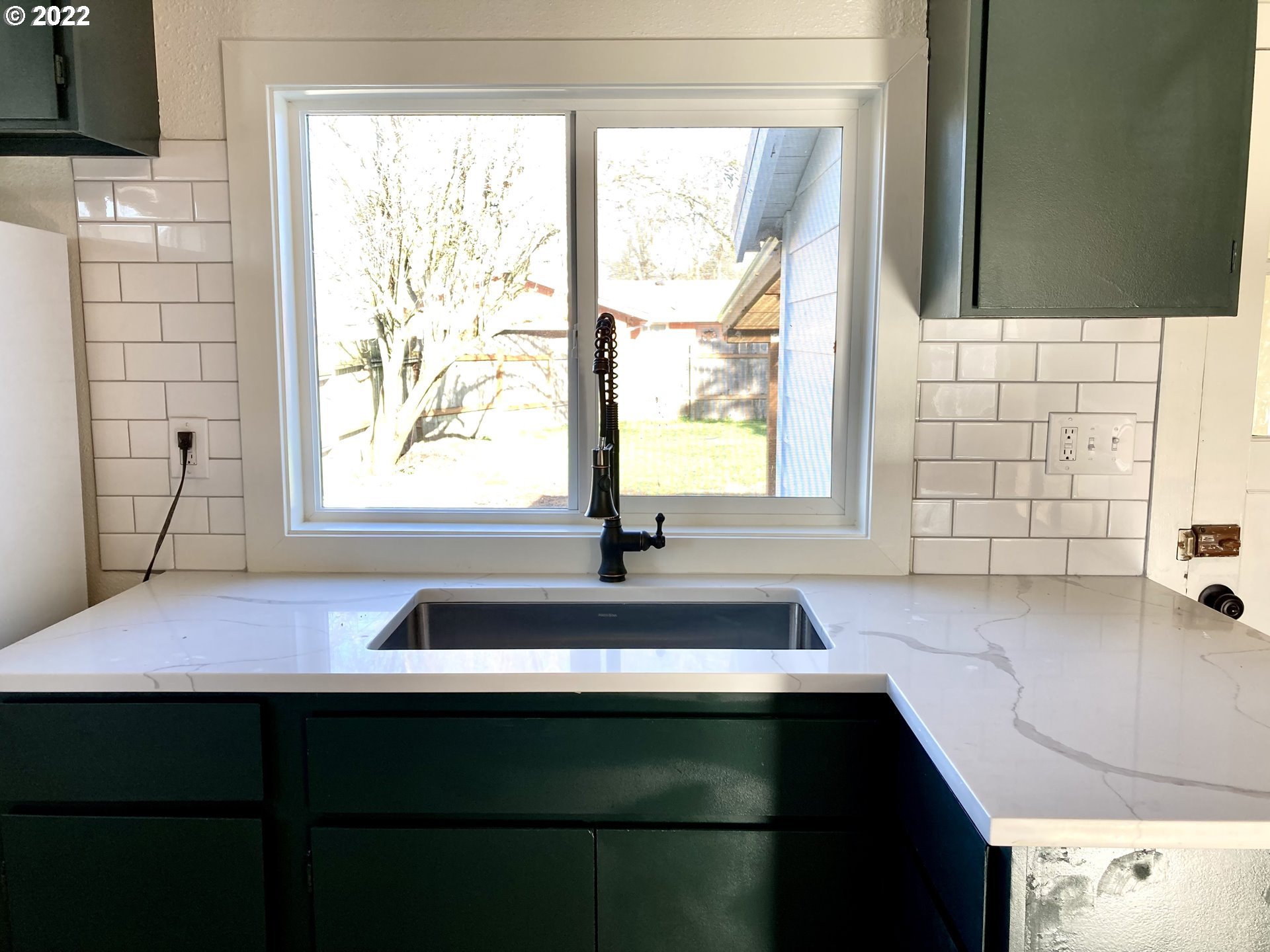 2440 G Street Springfield, OR 97477 - Photo 8 of 25 a bathroom with a sink and a bathtub