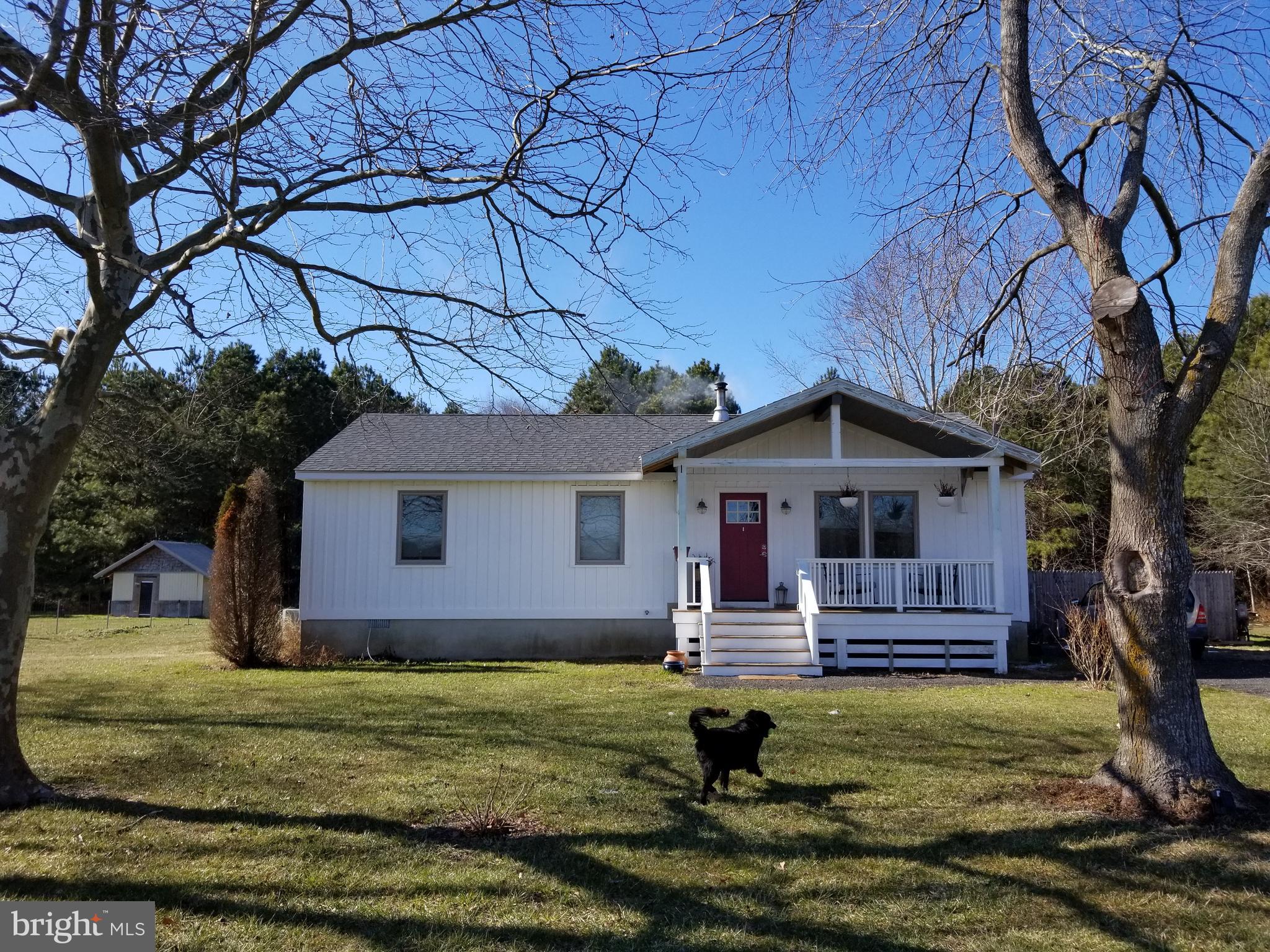 7741 Downs Road Newark, MD 21841 - Photo 1 of 22 a front view of a house with a yard