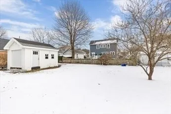 a view of a house with a snow in the yard