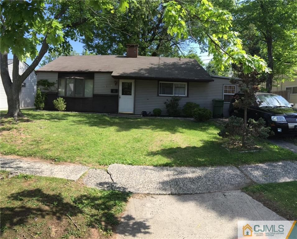 31 Colton Road Edison, NJ 08817 - Photo 2 of 10 a front view of a house with a yard and garage