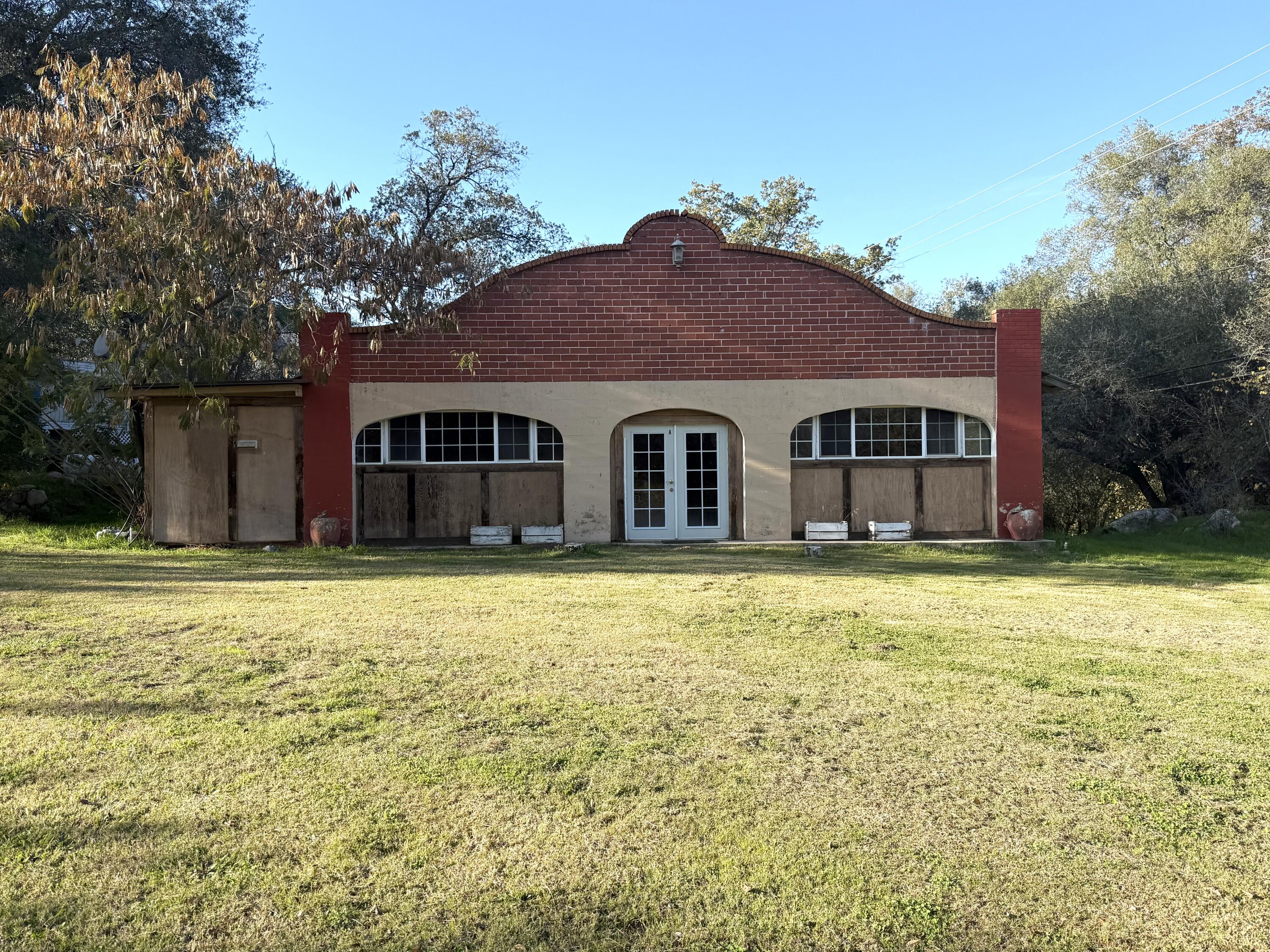 42751 North Fork Drive Three Rivers, CA 93271 - Photo 2 of 13 a front view of a house with a yard