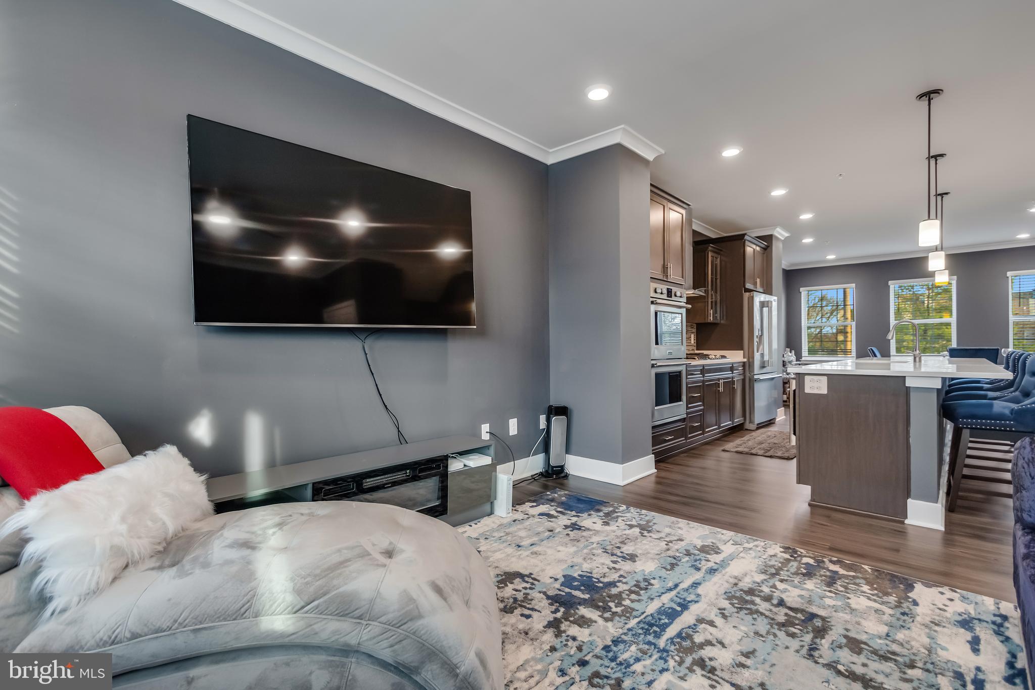 7806 Johnnycake Road Windsor Mill, MD 21244 - Photo 13 of 28 a living room with furniture and a flat screen tv