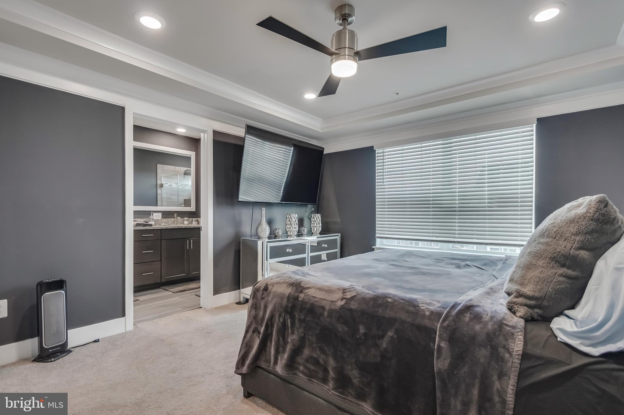 7806 Johnnycake Road Windsor Mill, MD 21244 - Photo 21 of 28 a bed room with a bed furniture and a tv