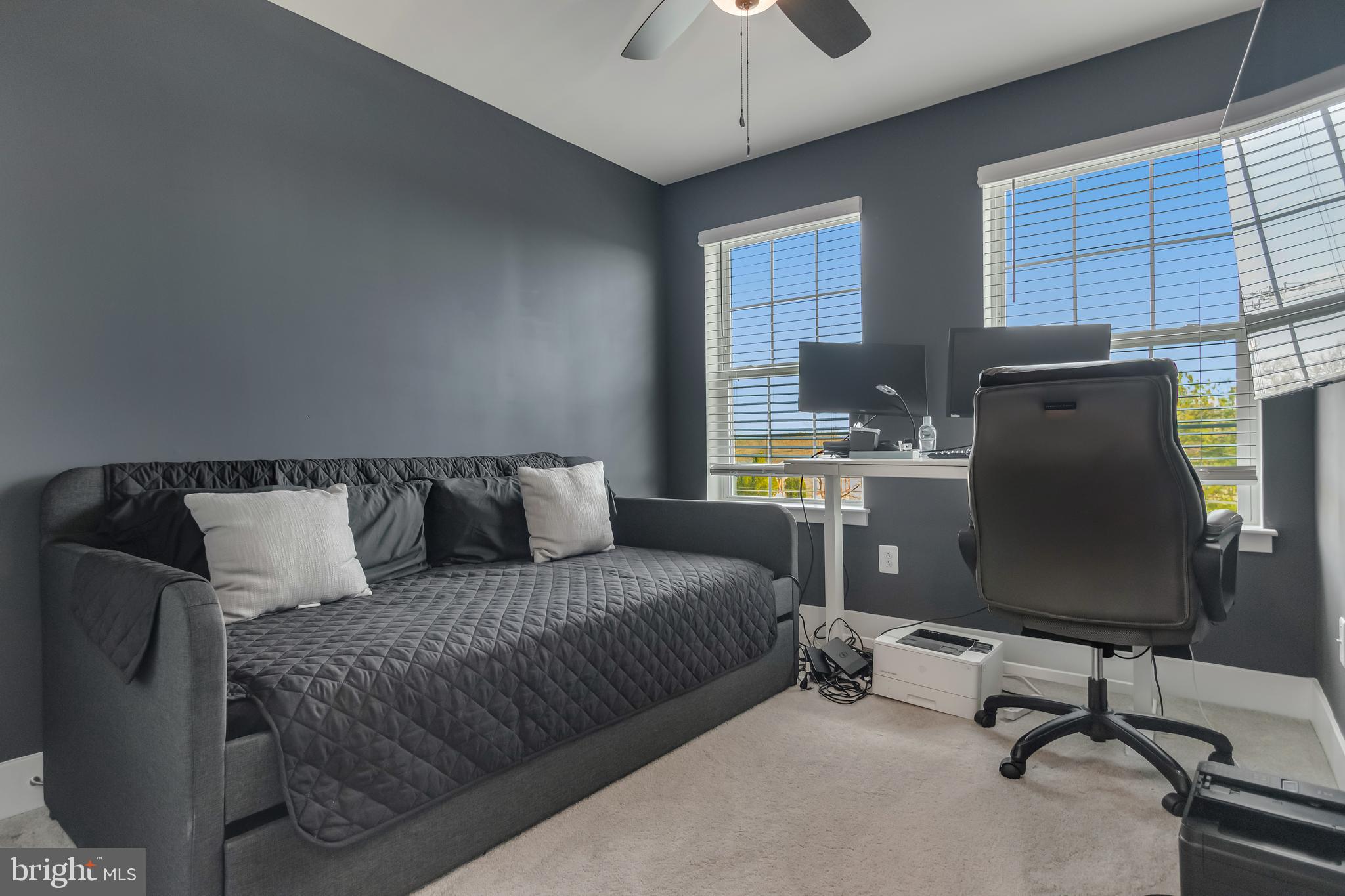 7806 Johnnycake Road Windsor Mill, MD 21244 - Photo 25 of 28 a bedroom with a bed and a desk