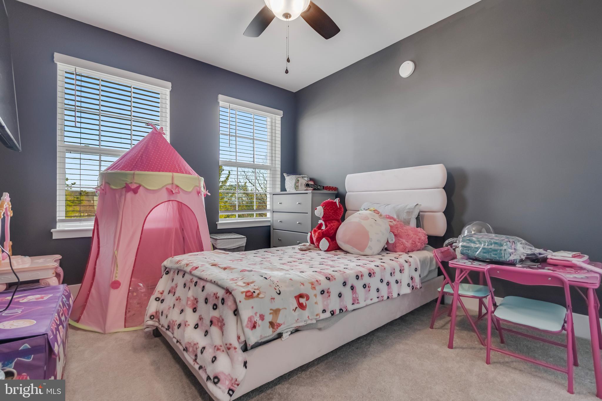7806 Johnnycake Road Windsor Mill, MD 21244 - Photo 26 of 28 a bedroom with a bed and a chandelier