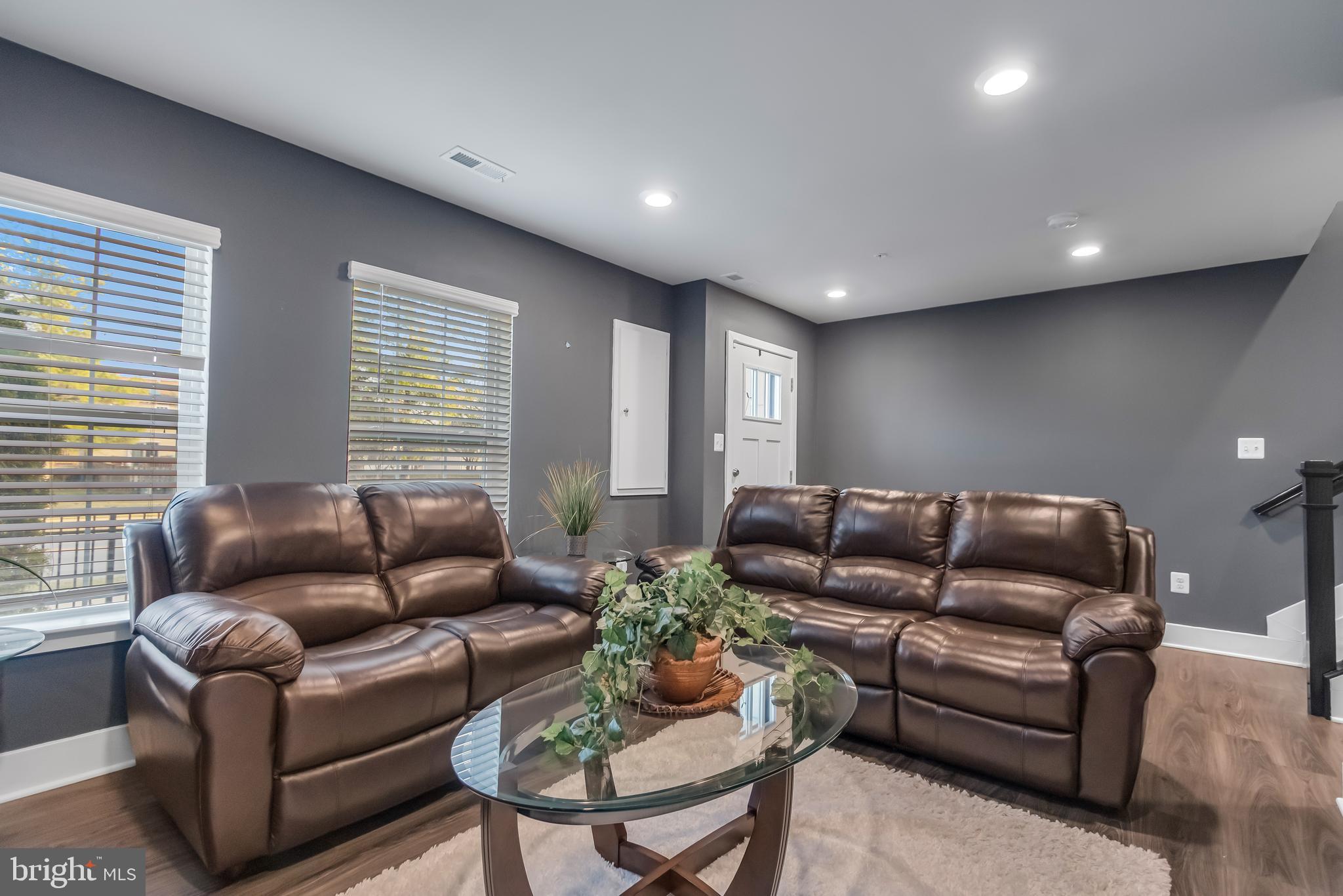 7806 Johnnycake Road Windsor Mill, MD 21244 - Photo 6 of 28 a living room with furniture and a large window