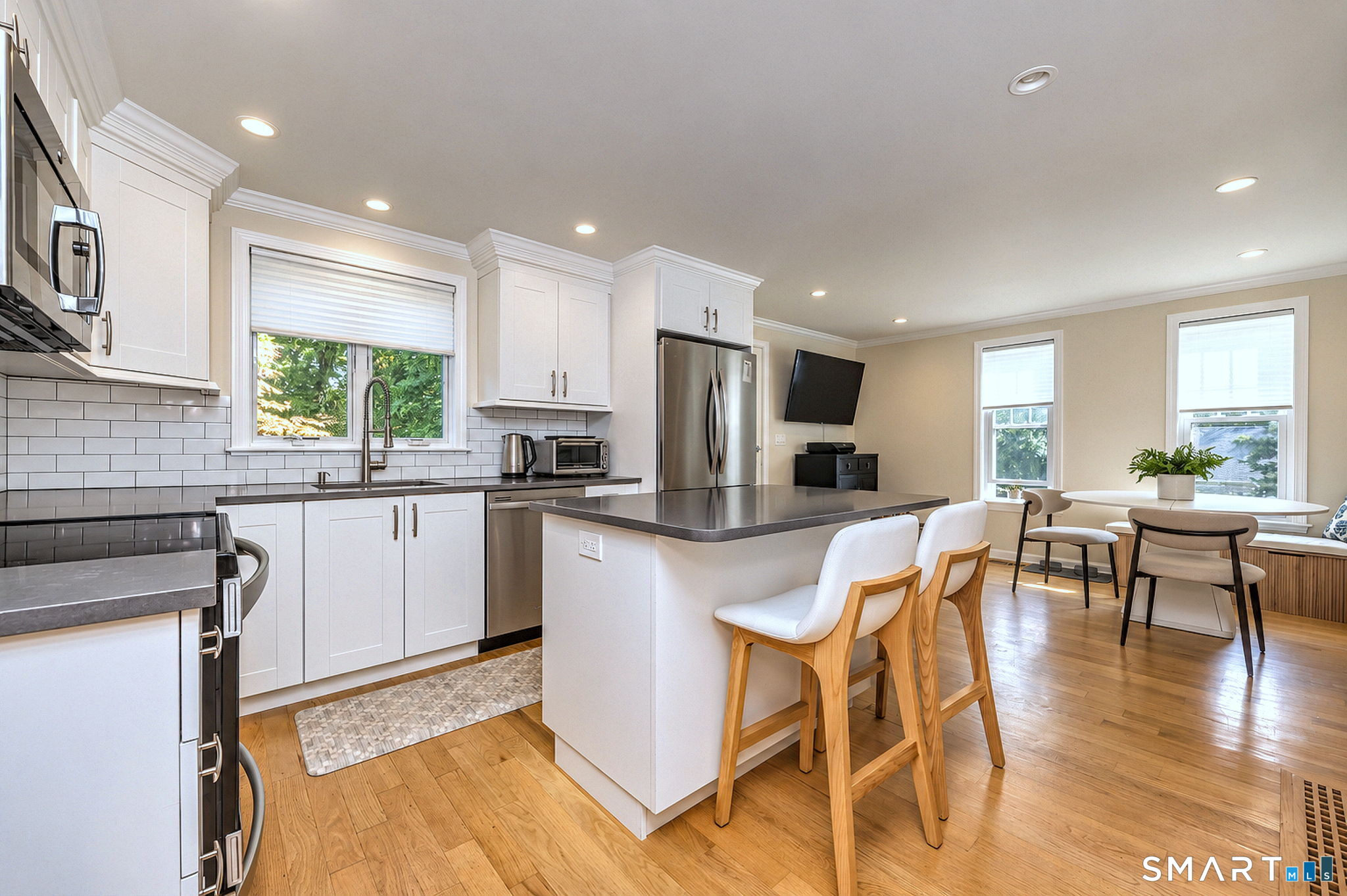 71 Country Road Fairfield, CT 06824 - Photo 12 of 36 Kitchen with granite counter island and stools