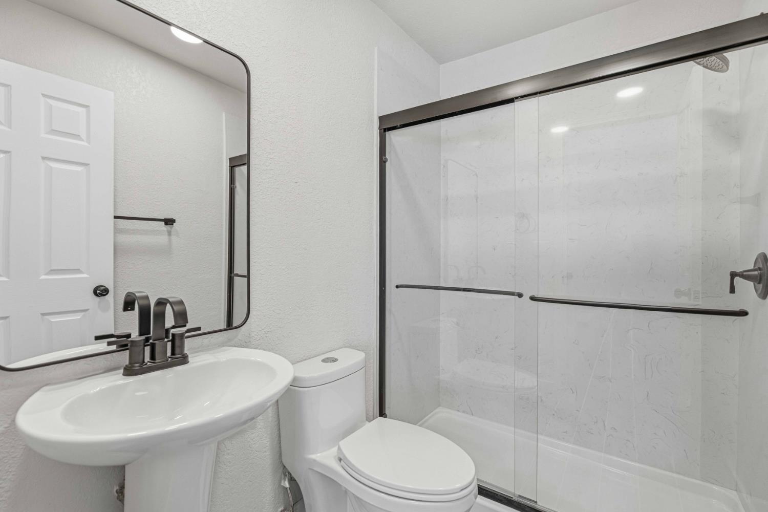 1464 Denise Drive Ripon, CA 95366 - Photo 27 of 41 a bathroom with a sink toilet and shower