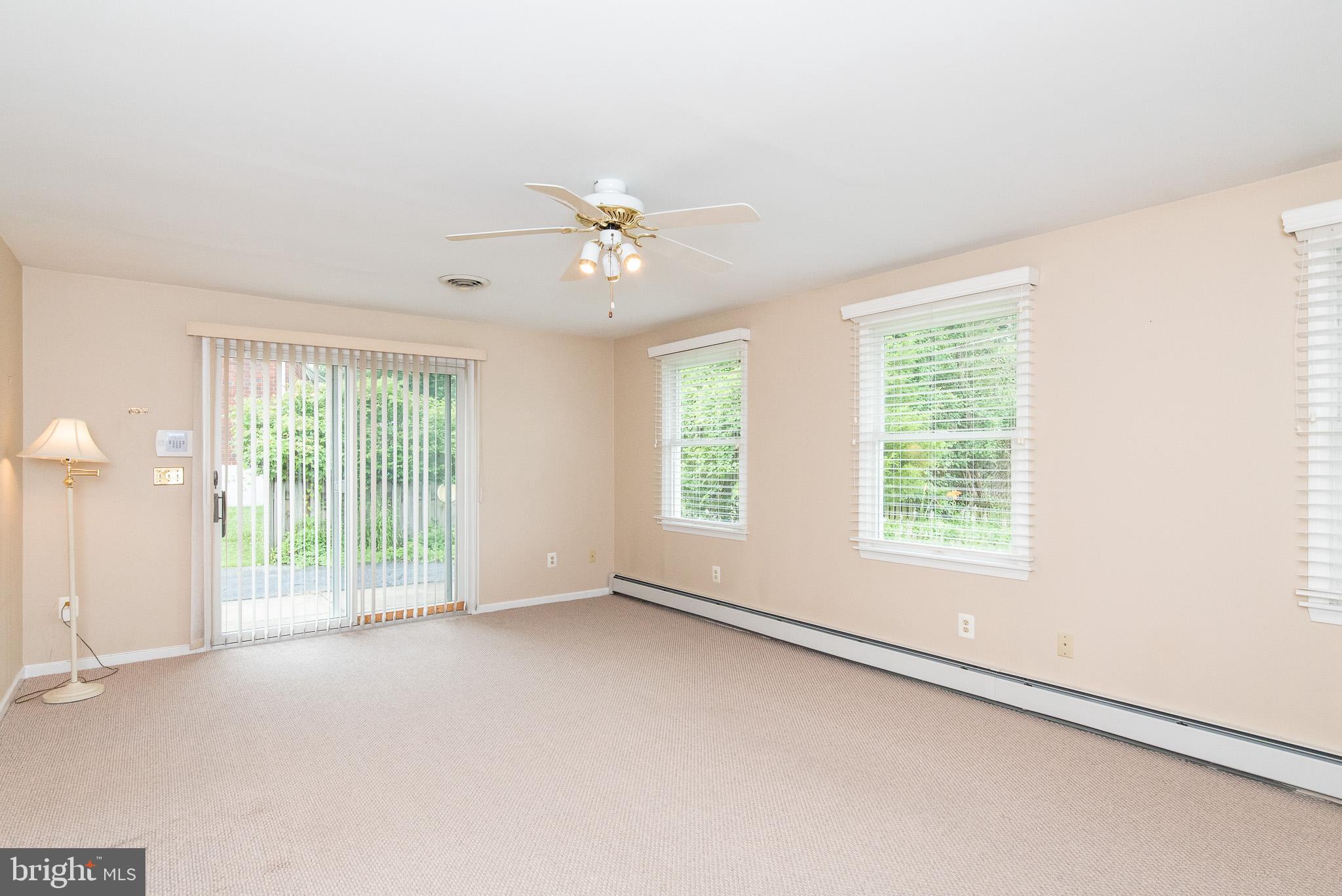 922 Starbit Road Baltimore, MD 21286 - Photo 17 of 31 Family room with sliders to driveway