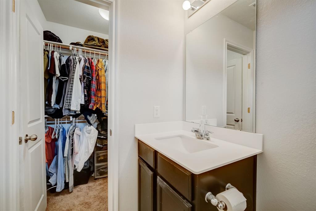 18002 Malnati Drive Pflugerville, TX 78660 - Photo 11 of 15 a bathroom with a sink and a mirror