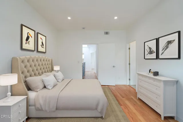 a bedroom with a bed and a couch