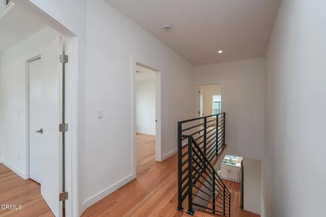 a view of an entryway with wooden floor