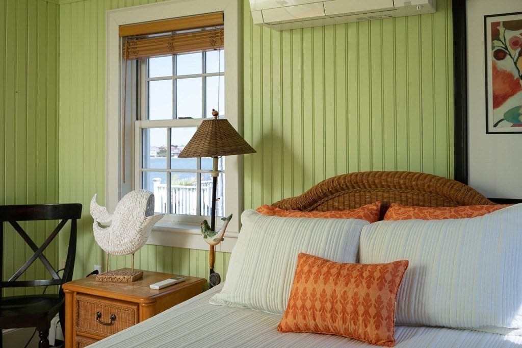 87 Bay Street Hull, MA 02045 - Photo 17 of 25 a bedroom with a bed and a window