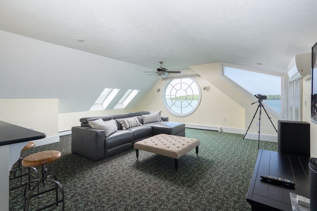 87 Bay Street Hull, MA 02045 - Photo 18 of 25 a living room with furniture a rug and a window