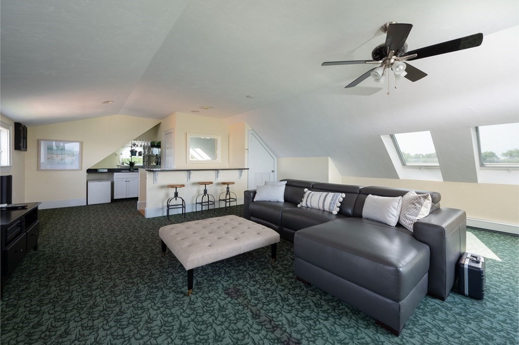 87 Bay Street Hull, MA 02045 - Photo 19 of 25 a living room with furniture and a wooden floor