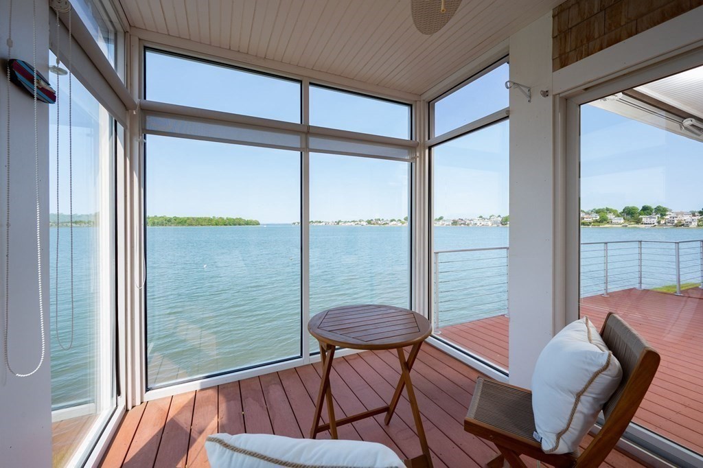 87 Bay Street Hull, MA 02045 - Photo 9 of 25 a balcony view with a couch and chairs