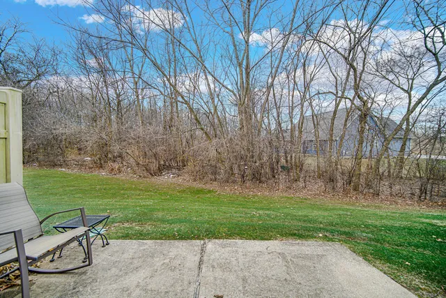 a view of a chairs and table in the garden