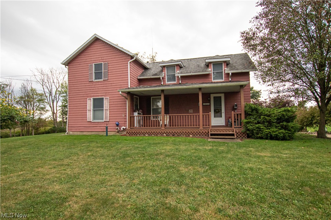 3946 Poe Road Medina, OH 44256 - Photo 1 of 35 Rear view of property featuring a lawn