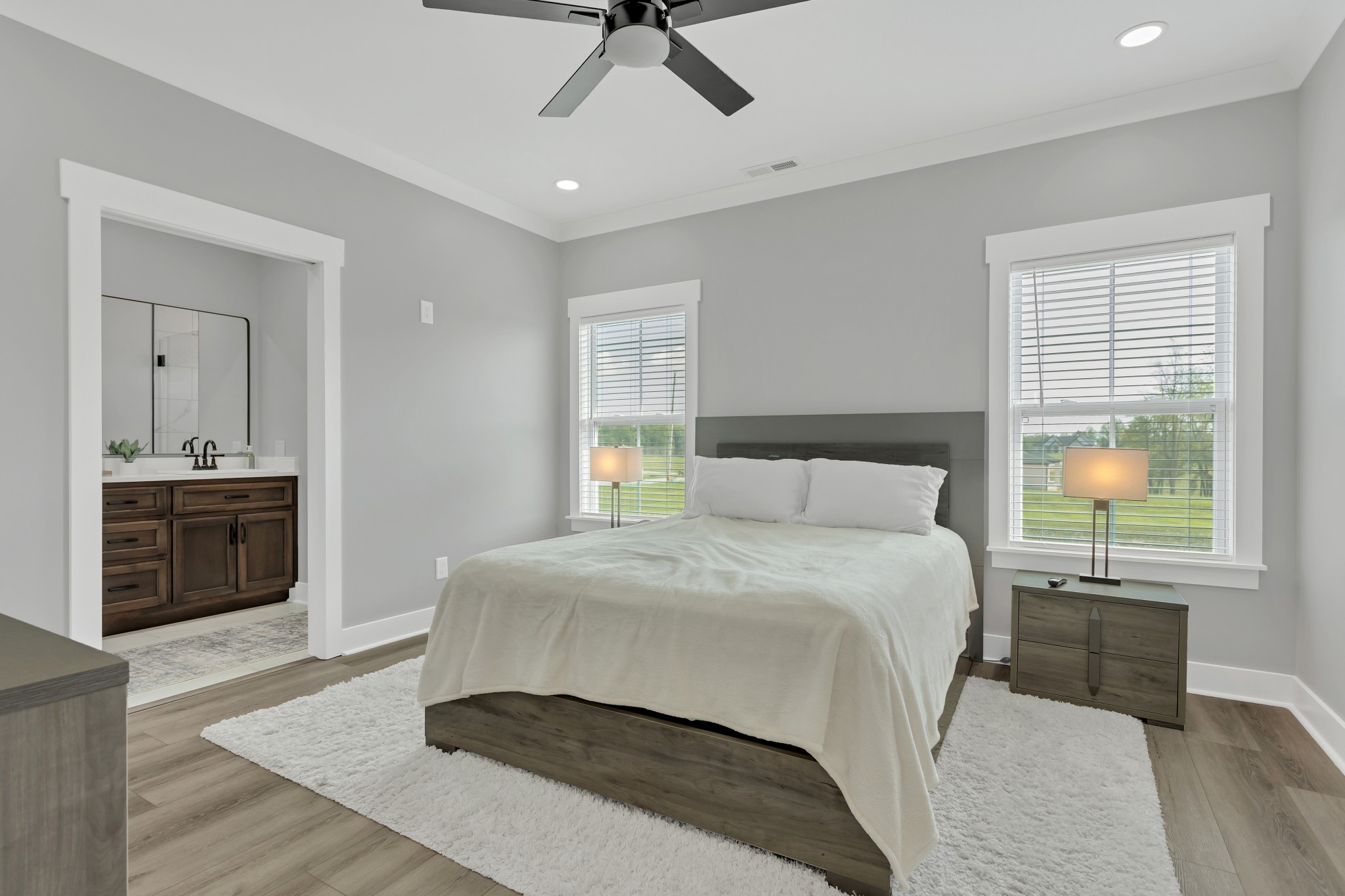 200 Beartown Road Loretto, TN 38469 - Photo 12 of 24 a spacious bedroom with a bed and a chandelier