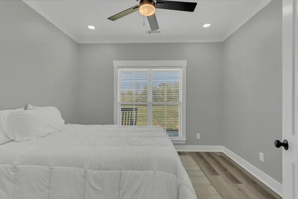 a bedroom with a bed and window